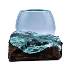 Handmade molten glass bowl from AW GIFTS resting on natural wood, ideal for home decor with vibrant, swirling glass patterns.