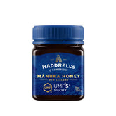 Jar of Herbalistas Haddrells Manuka Honey UMF5+ with MGO83+ in a 250g container, showing the honey's golden, viscous texture.