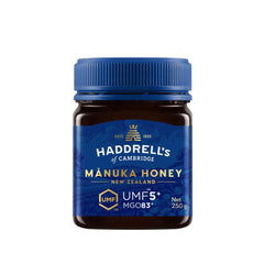 Jar of Herbalistas Haddrells Manuka Honey UMF5+ with MGO83+ in a 250g container, showing the honey's golden, viscous texture.