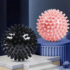 Portable TEMU massage ball for muscle relief, shown in close-up with textured surface for targeted pressure therapy.