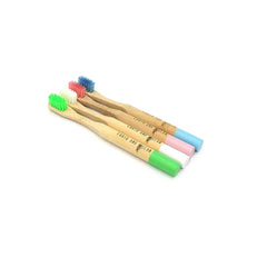 Old Products bamboo kids' toothbrush set featuring two colorful toothbrushes with ocean and earth-themed handles.