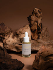 Selfnamed Rosemary Hair & Scalp Strengthening Oil bottle with dropper, showcasing natural ingredients and sleek packaging.