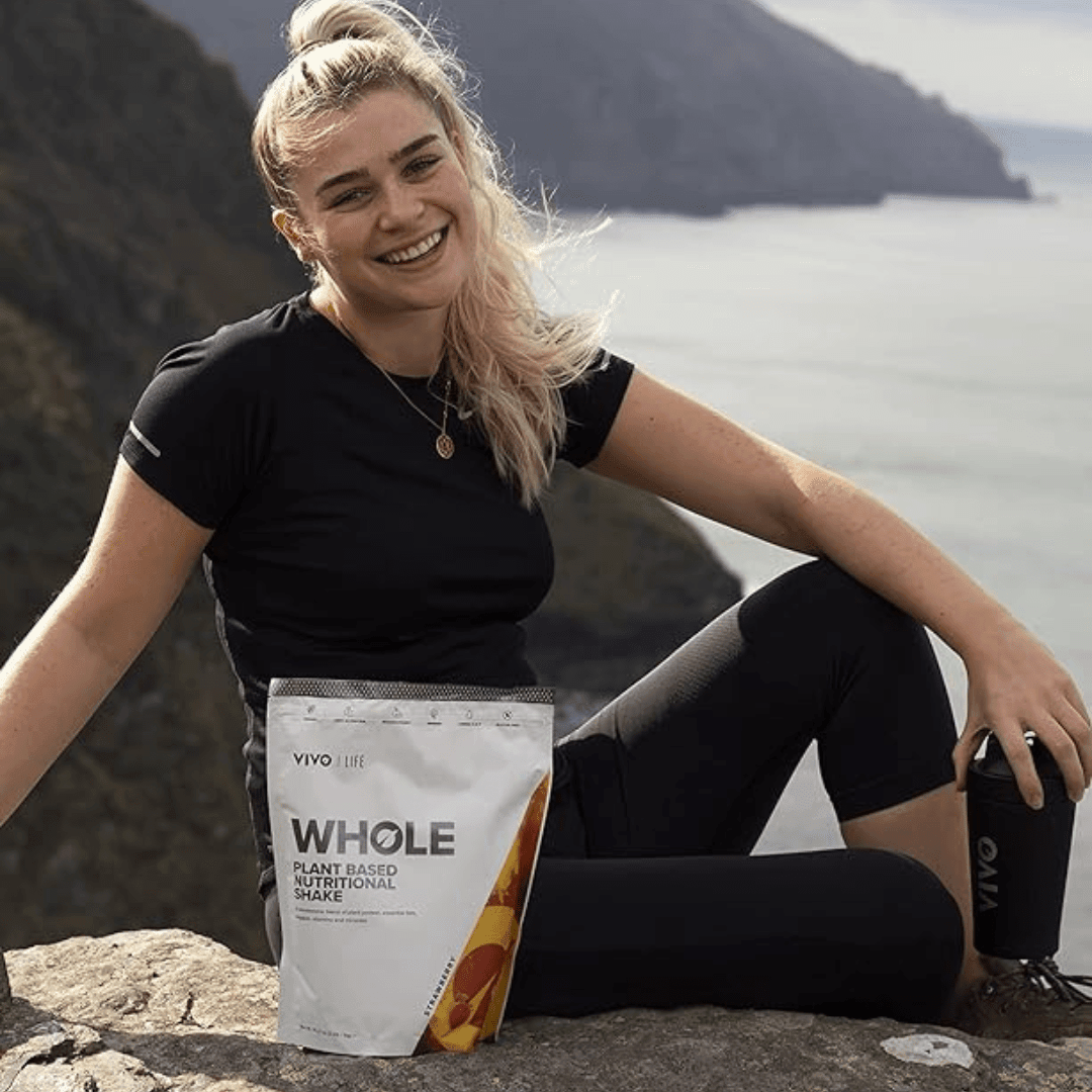 Vivo Life Whole Plant Based Nutritional Shake supplement in a container with a scoop and ingredients on the label.