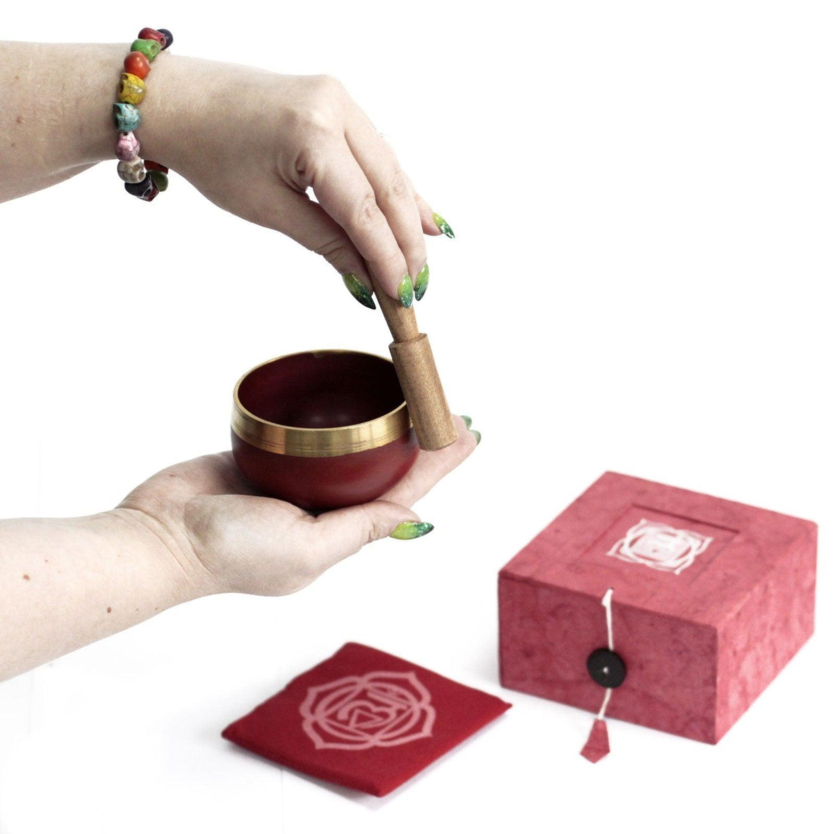 AW GIFTS Chakra Singing Bowl - Root, a brass accessory for meditation and chakra balancing, showing intricate engraved design.