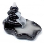 Large back flow incense burner by AW GIFTS featuring pebble design flowing into a pool for aromatic smoke display.