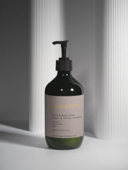 Selfnamed Ginger & Smoky Cardamom Hand & Body Wash bottle with pump, featuring a sleek design and aromatic fragrance.
