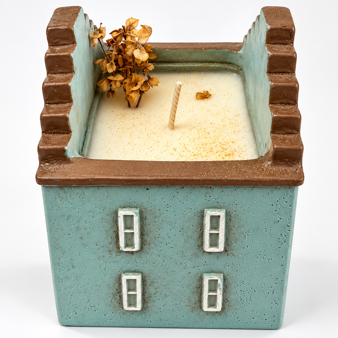 Velarte Little Haven handmade soy wax house candle in wavy blue design, showcasing intricate candle details and textured surface.
