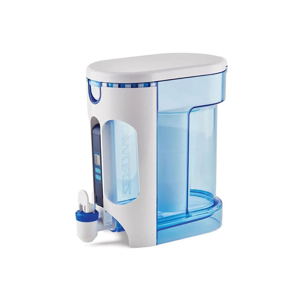Herbalistas ZeroWater 2.8L water filter dispenser with Ready Read digital display, clear plastic body, and removable filter in use.