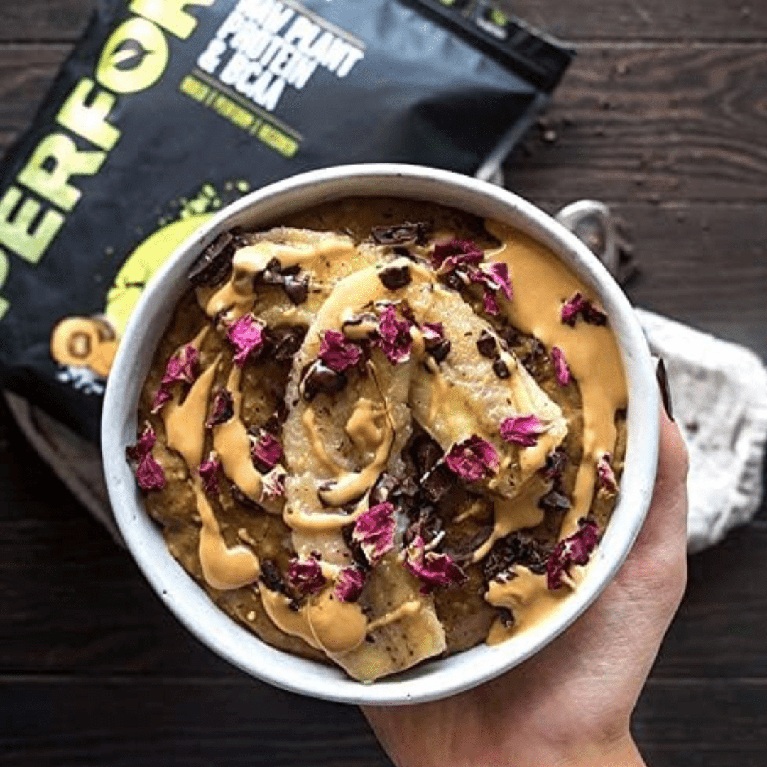 Large container of Vivo Life PERFORM Raw Plant Protein & BCAA protein powder with scoops and label details.