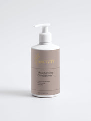 Selfnamed moisturizing conditioner bottle with pump dispenser, showcasing smooth, creamy formula for nourishing hair.
