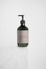 Selfnamed Ginger & Smoky Cardamom Hand & Body Wash bottle with a pump dispenser and natural ingredients visible.