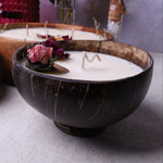Soy wax candle in a coconut bowl with base, Velarte brand, showcasing a cozy, natural home decor accessory.