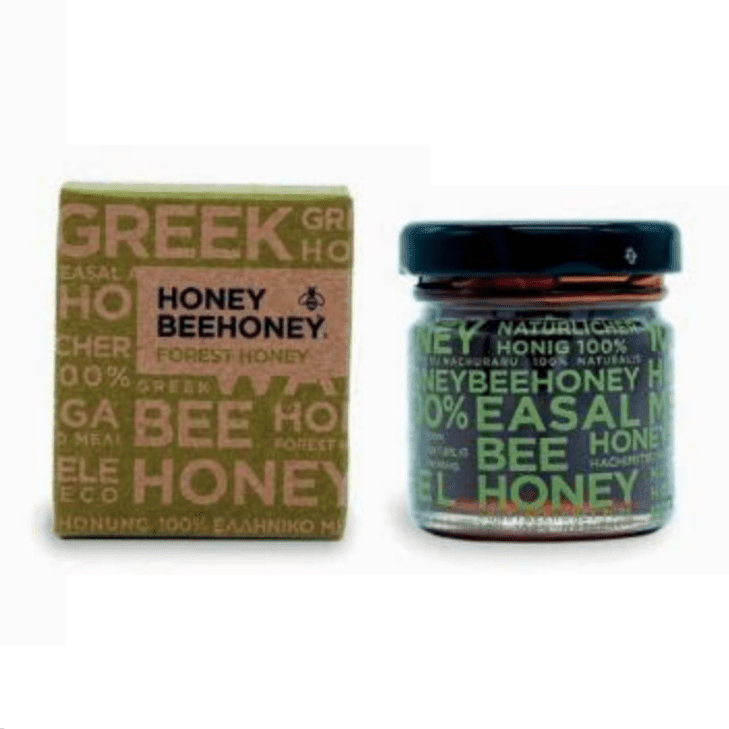 Bottle of LV Natural Foods Luxury Forest Honey, a superfood with natural golden honey dripping from a honey dipper.