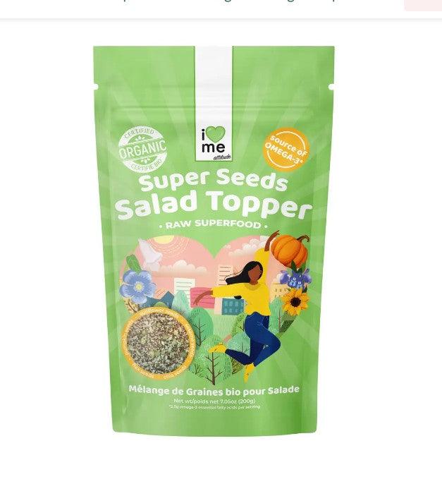 Organic raw salad seed mix snack by ILOVE ME, featuring a colorful blend of raw seeds in a clear bowl.