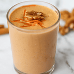 Vegan Green Life Books smoothie recipe book cover featuring a vibrant creamy carrot cake smoothie in a glass.