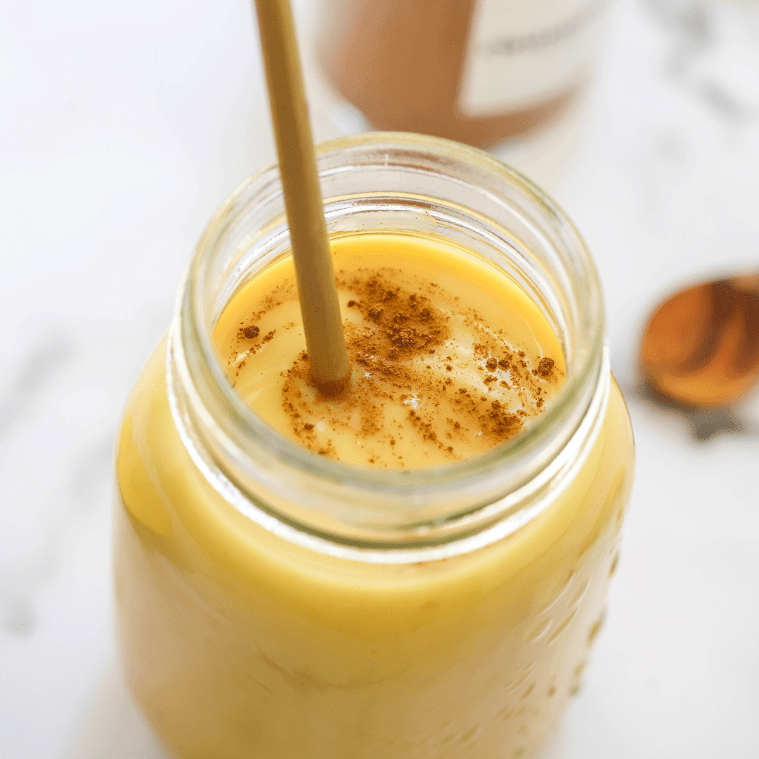 Vegan recipe book cover showing "The High Protein Golden Glow Smoothie" with vibrant smoothie images from Green Life Books