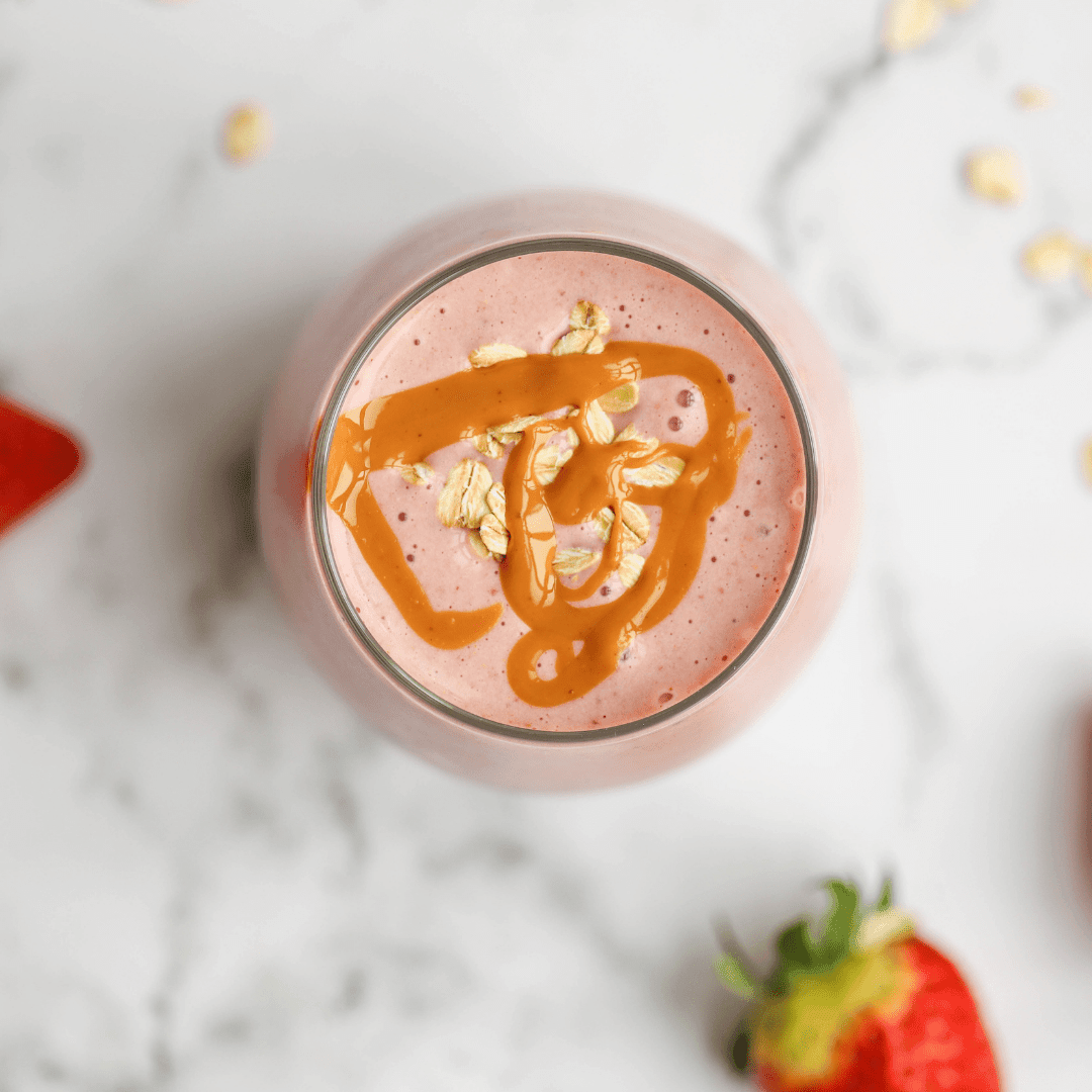 Vegan recipe book cover for Green Life 30 Healthy & Delicious Smoothie Recipes featuring a vibrant strawberry breakfast smoothie.