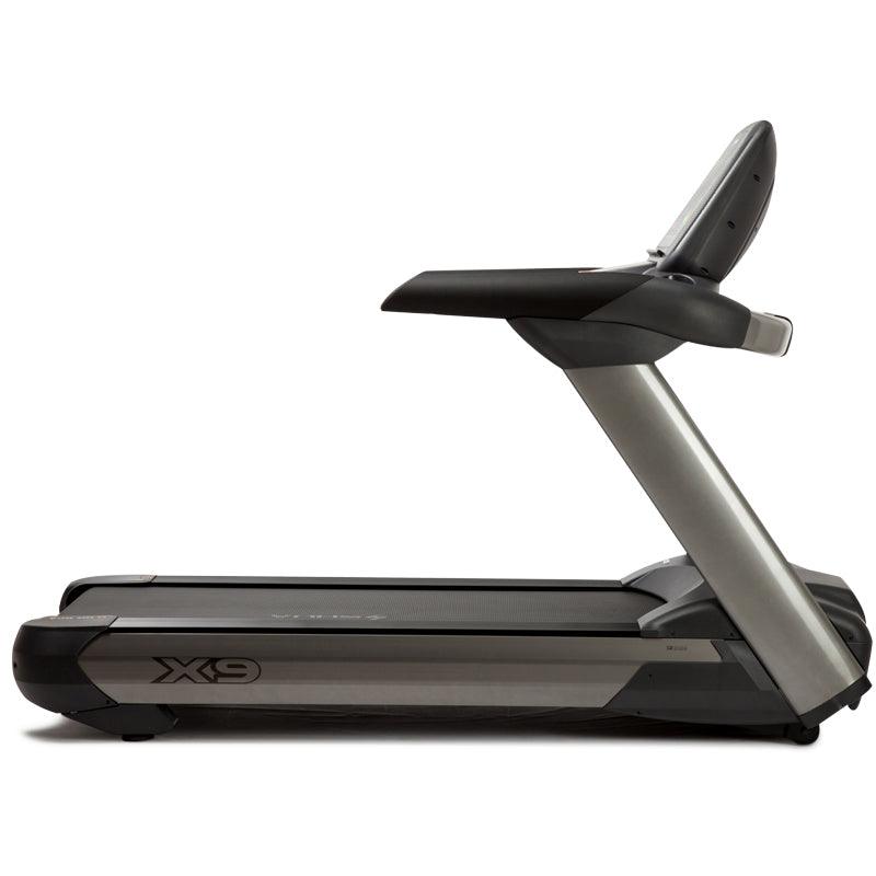 Side view of the Viking Fitness SHUA X-9 professional electric treadmill showing its running deck and control panel.