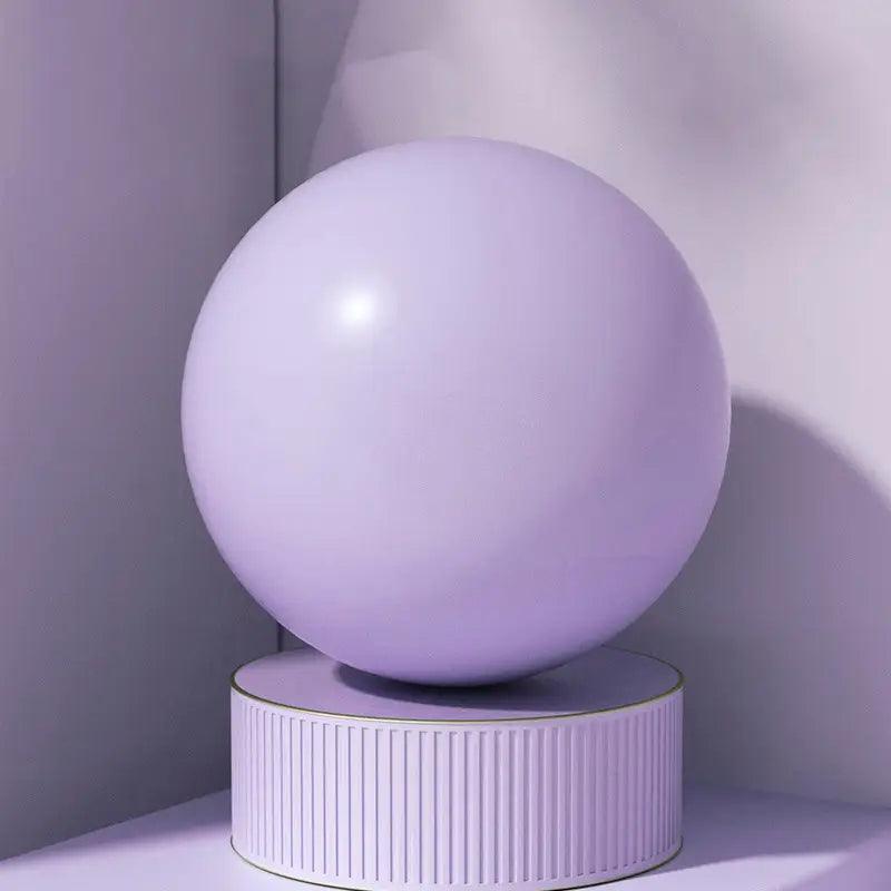 TEMU premium thick Pilates ball, 24.99cm diameter, flexible exercise accessory for core workouts and fitness routines.