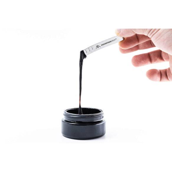 Herbalistas MountainDrop Original 100% Pure Mumijo Shilajit Resin supplement jar with 45g label and natural resin inside.
