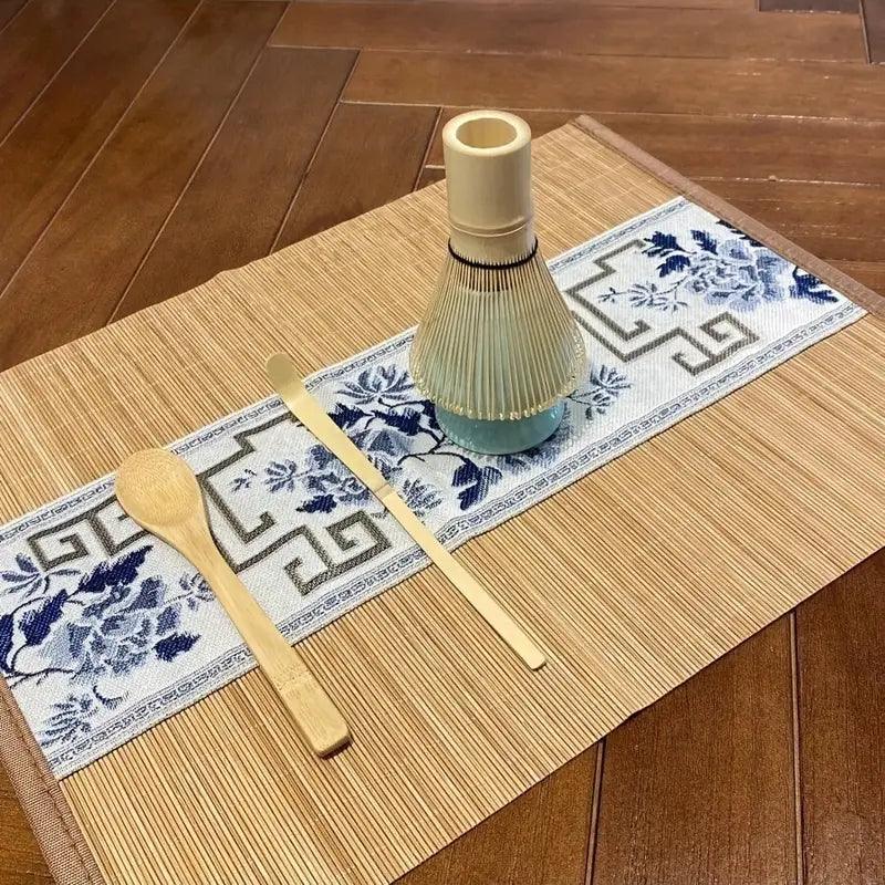 Set of four TEMU matcha accessories including bamboo whisk and tea spoon, ideal for preparing traditional matcha tea.