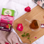 Organic India BIO Tulsi Sweet Rose herbal tea in a tea bag, featuring a fragrant rose aroma and caffeine-free infusion.