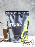 Vivo Life dark chocolate plant-based protein powder in a jar, 30 servings, creamy texture with rich chocolate flavor.